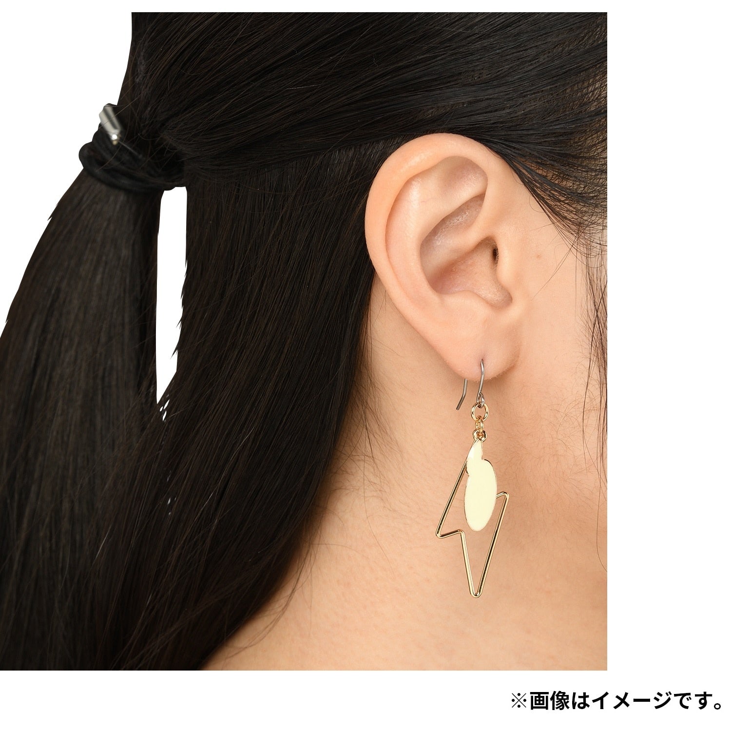 Pokémon Earrings on a display stand, showcasing anime-style, Japanese collectible
