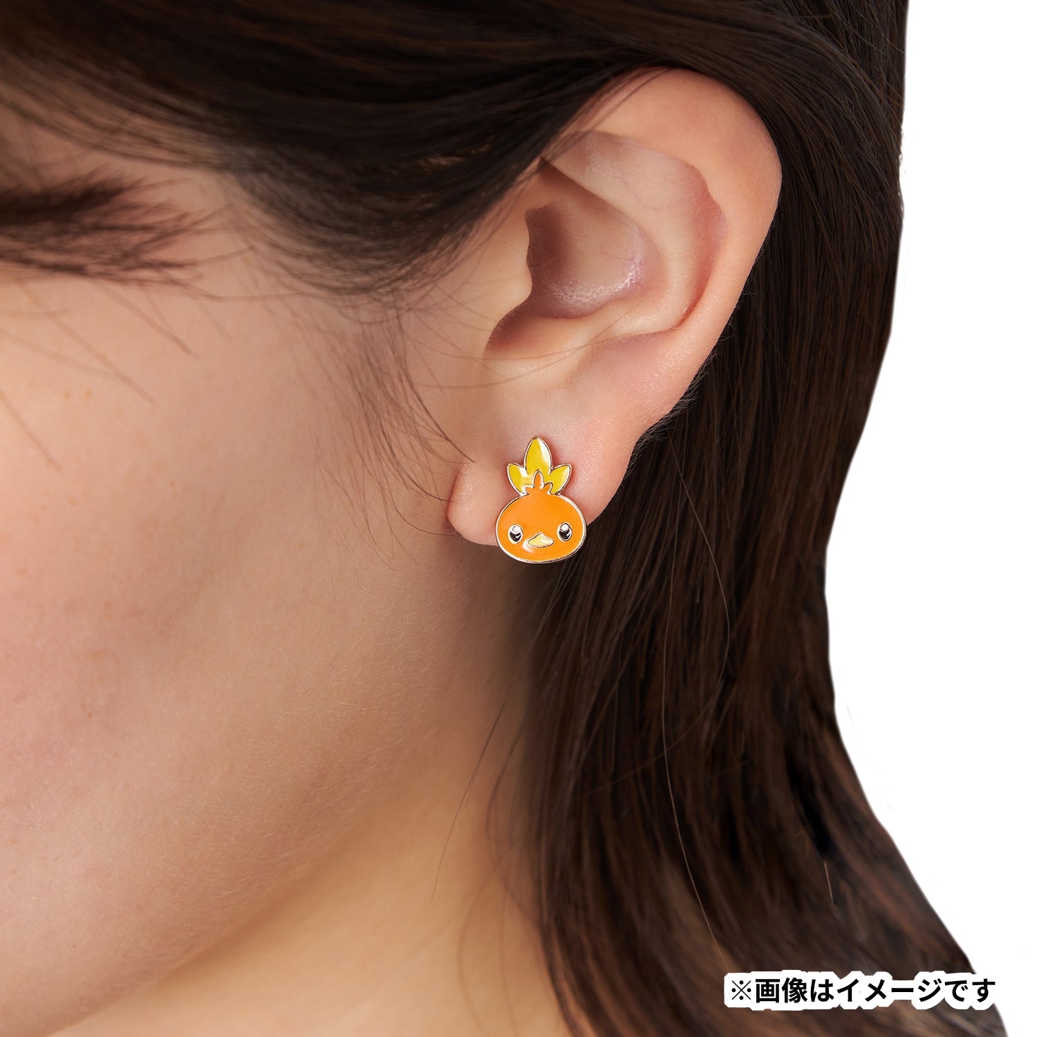 Close-up of Pokémon Achamo earrings with Japan packaging