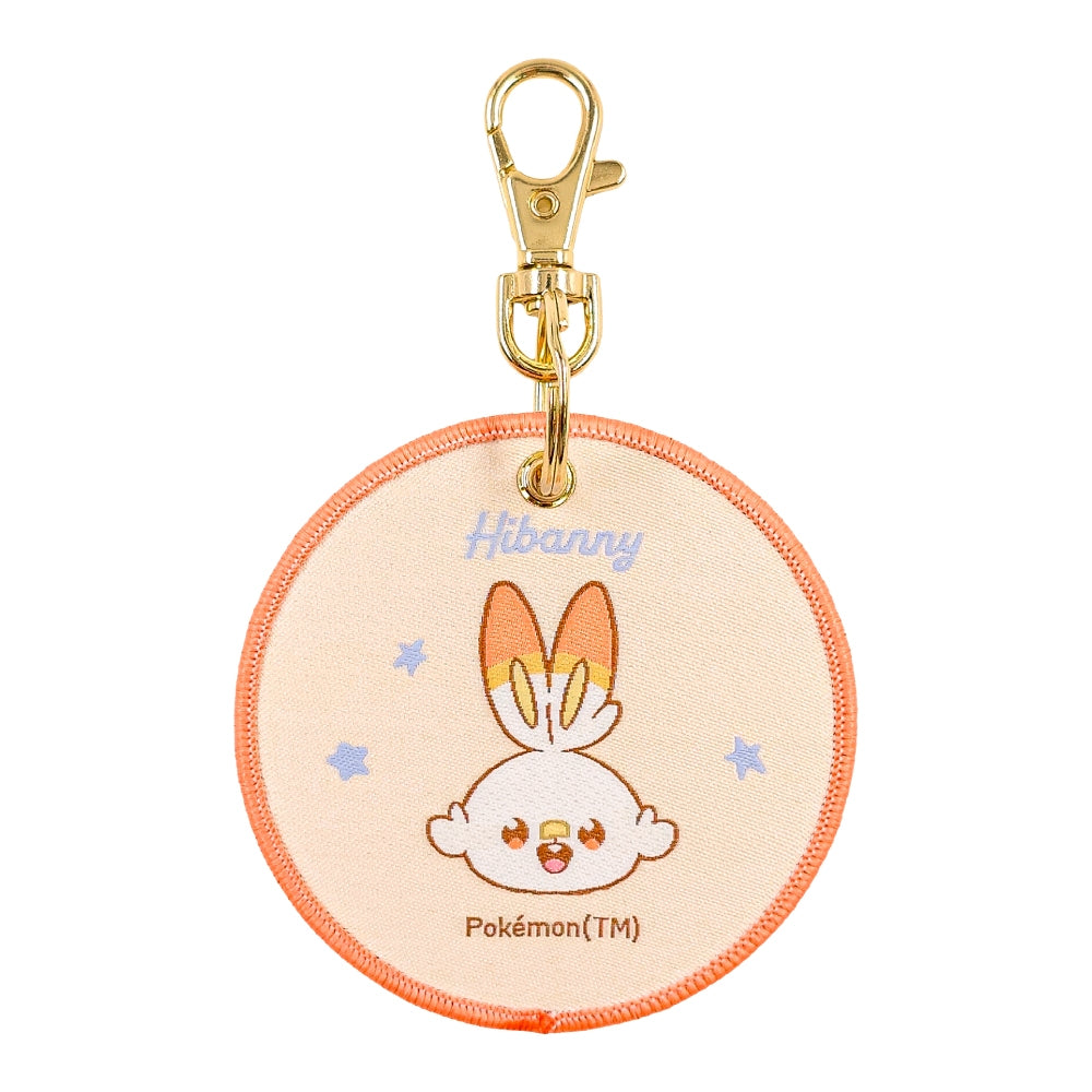 Close-up of Woven Hibani Pokepiece keychain, showcasing official Pokemon artwork from Japan