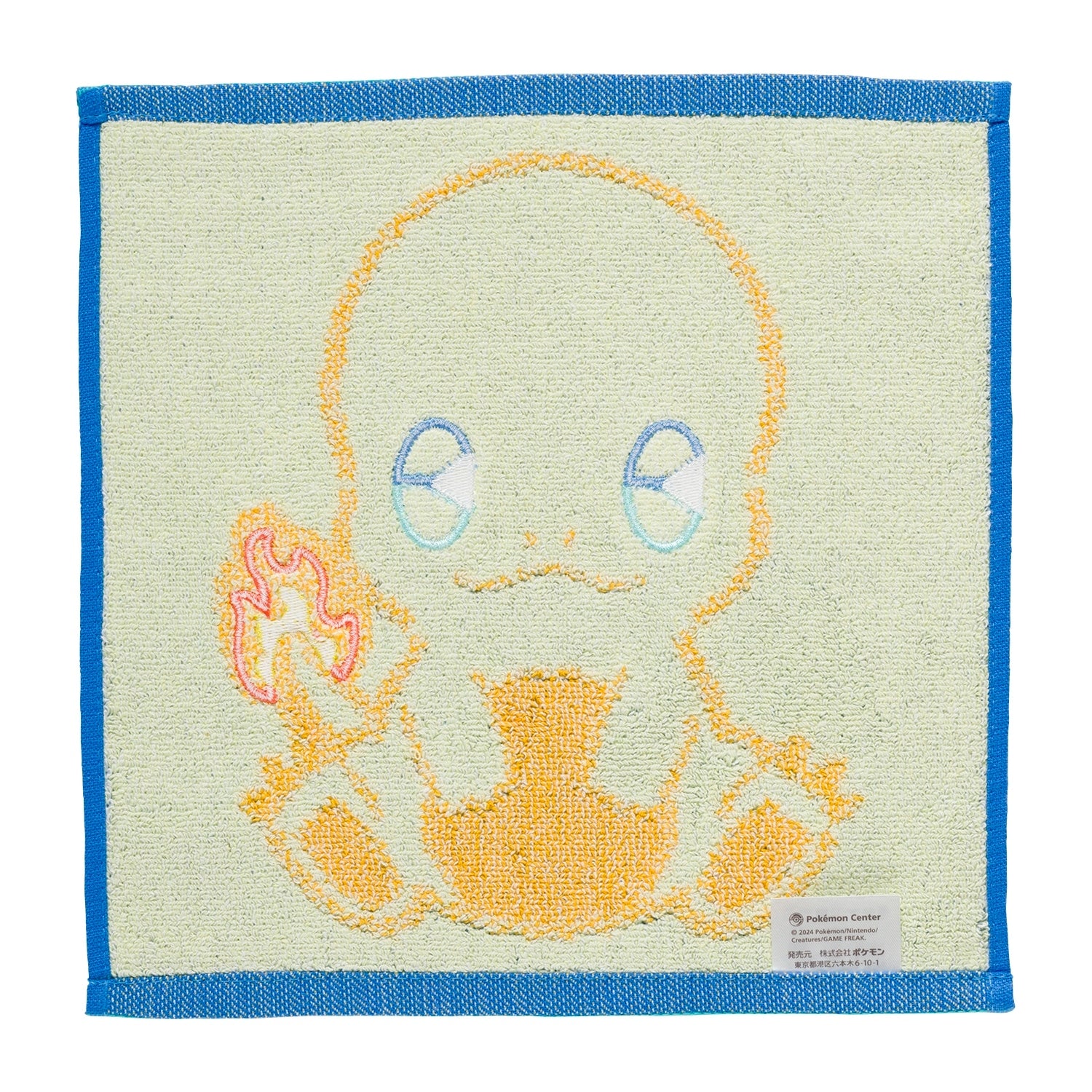 Close-up of Charmander hand towel with vibrant colors, made in Japan