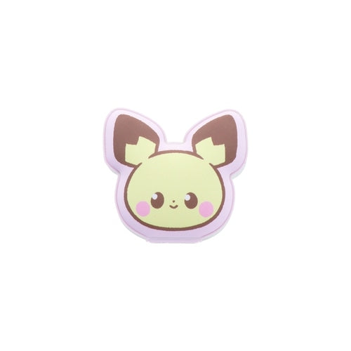 Pichu figure standing on a flat surface, showcasing its tiny size, from Japan