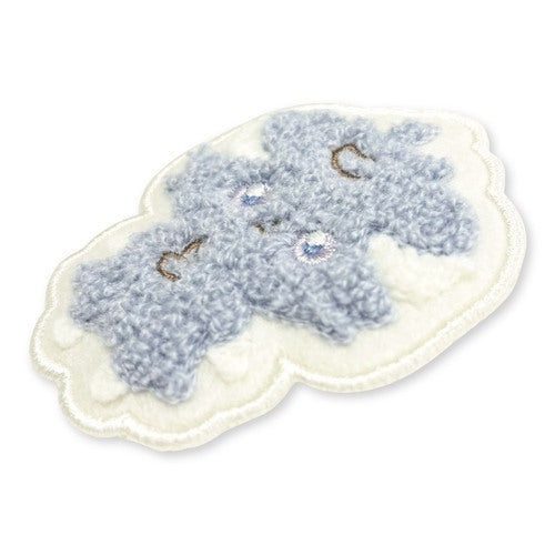 Espurr pin on a white background, highlighting the detailed enamel work, a unique Japanese collectible