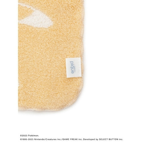 Close-up of Pokemon hand towel from Japan with detailed stitching and yellow fabric