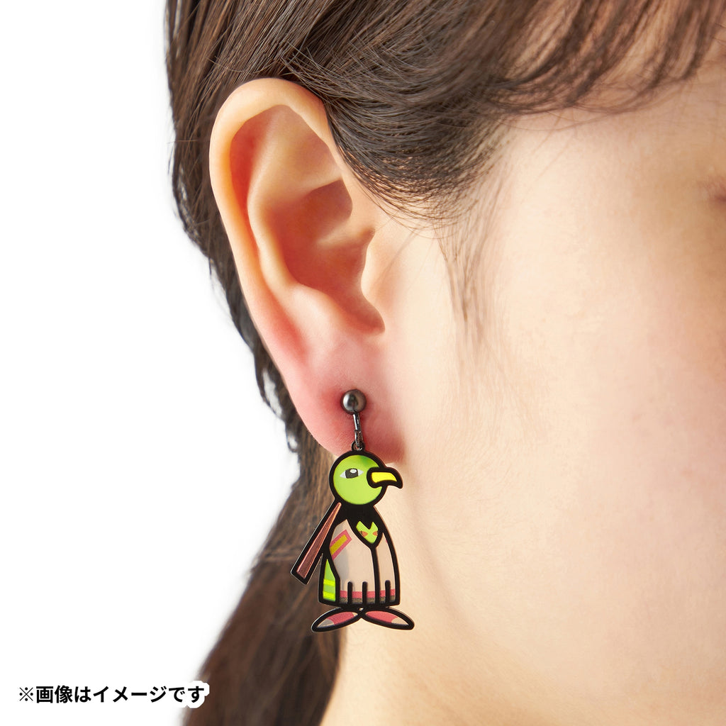 Pokémon Earrings 106 Natio on a display stand with Japanese-themed background
