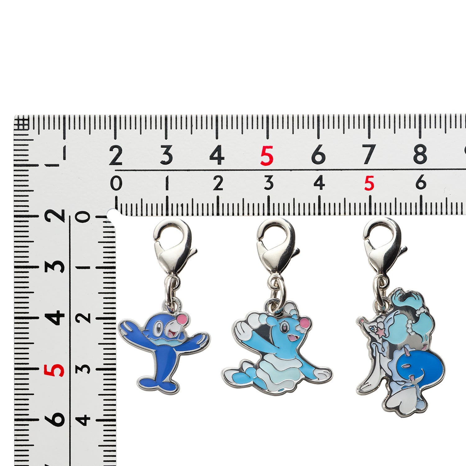 National encyclopedia metal charms 729, 730 from Japan, showcasing intricate Pokemon characters in metal
