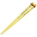 Skater painted chopsticks with mascot Winnie the Pooh/AND45_674624