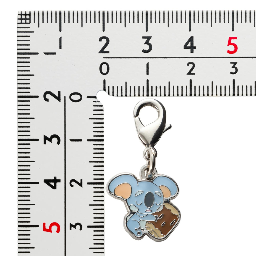 Pokemon Metal Charm 775, collectible item from Japan with intricate design and official logo