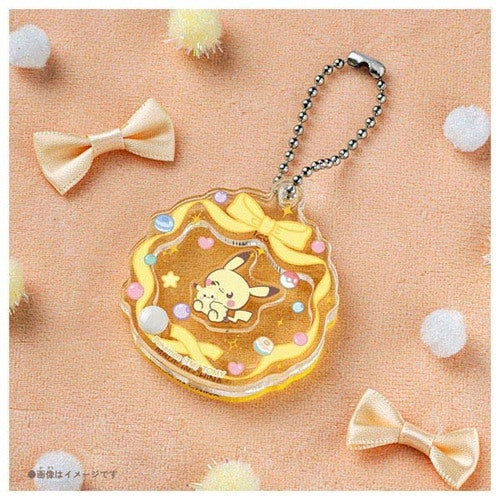 Collectible Pokemon charm from Japan, displaying unique moving design and authentic packaging
