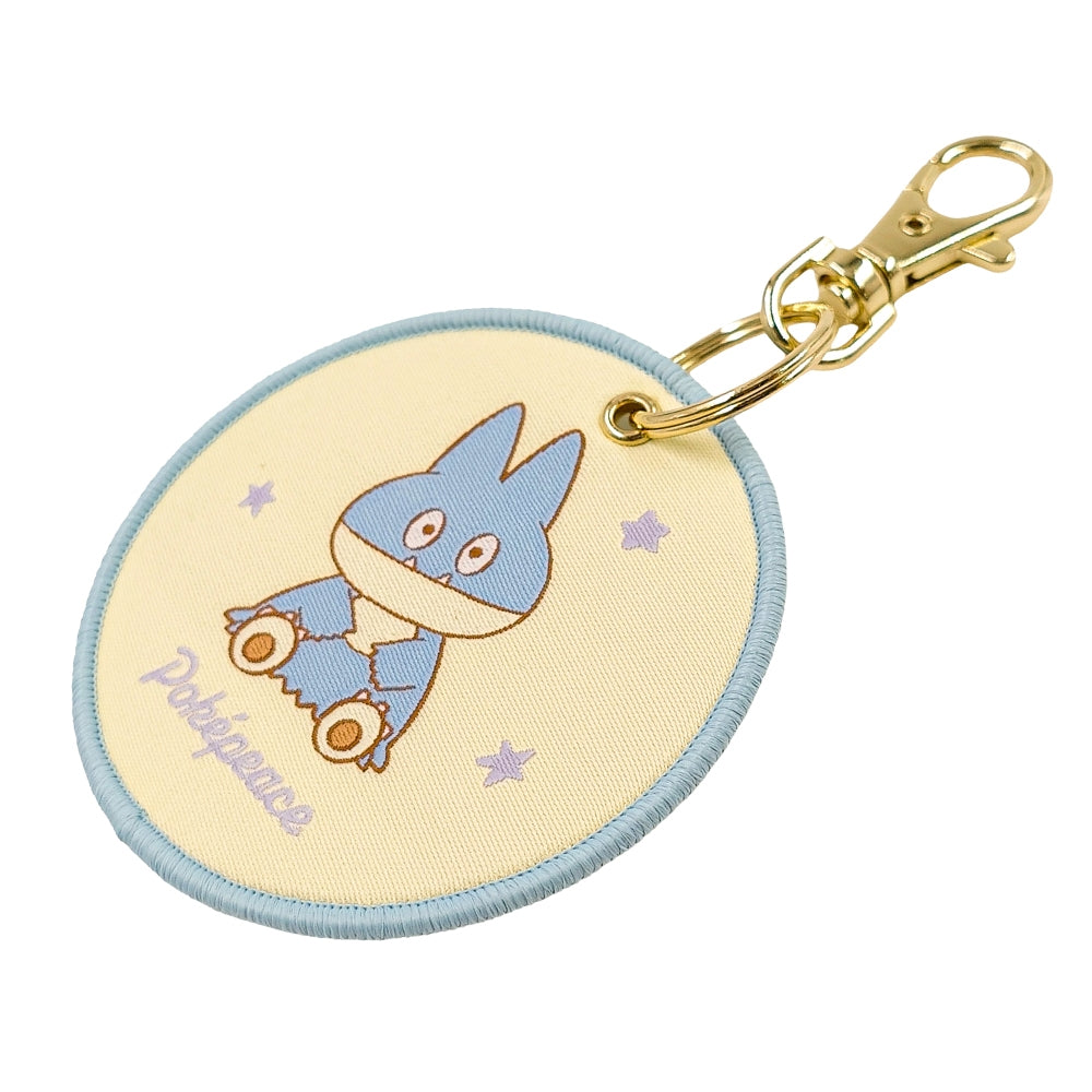 Munchlax keychain figure on a white background, officially licensed from Japan
