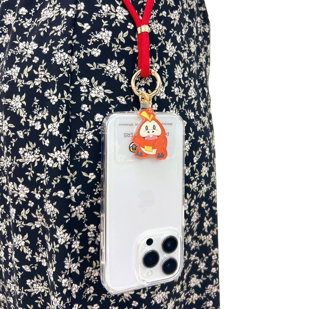 Fuecoco strap on a smartphone, showcasing Japan's exclusive design