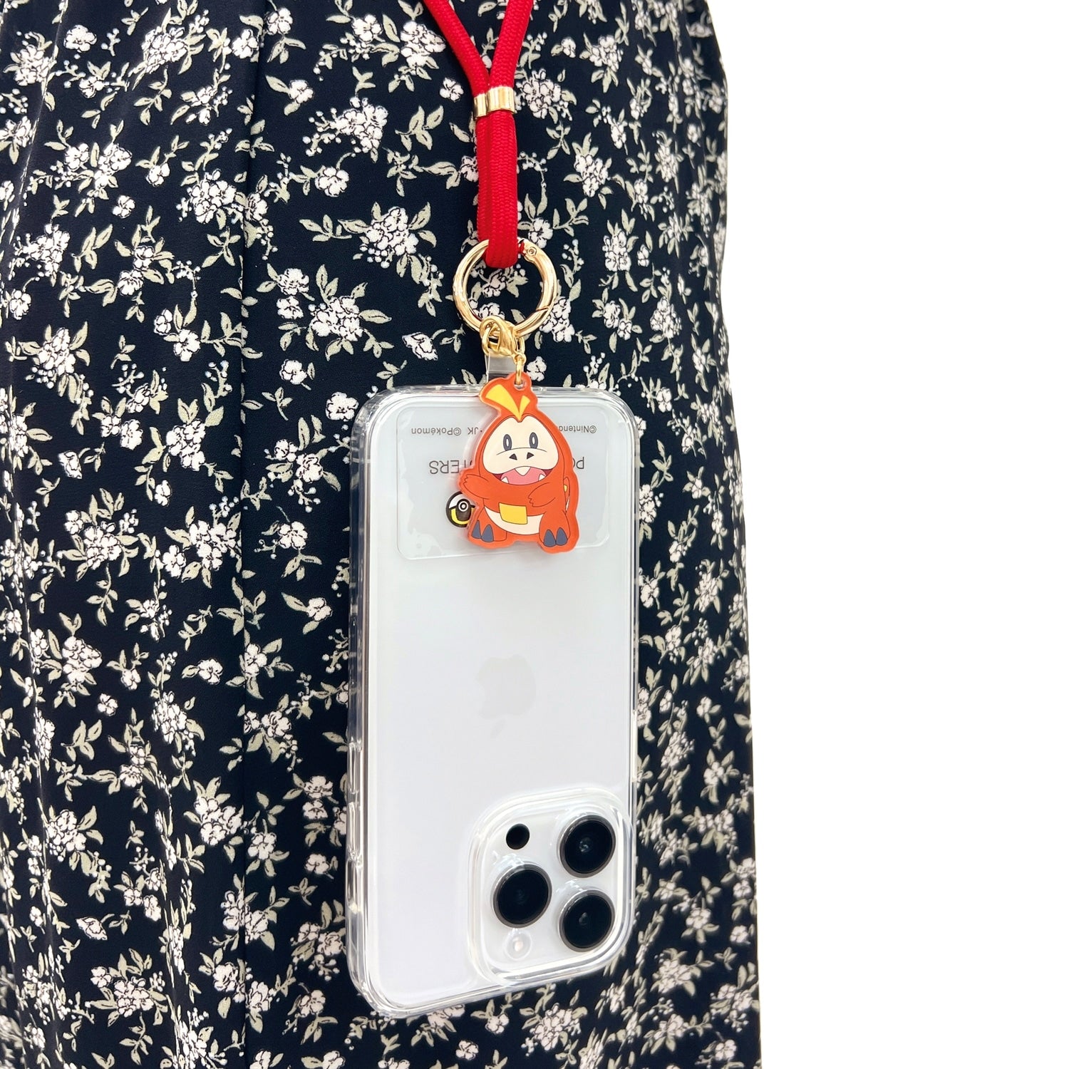 Fuecoco strap on a smartphone, showcasing Japan's exclusive design