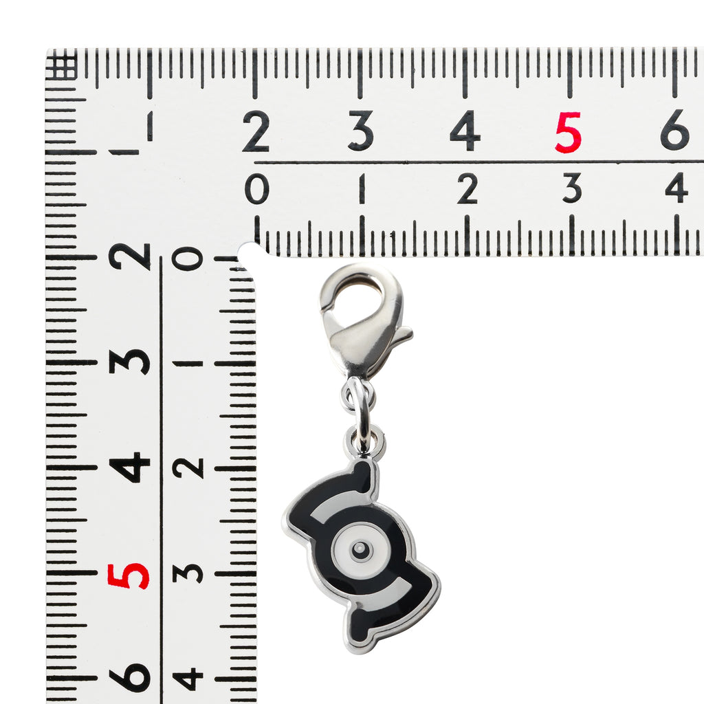 Pokemon Metal Charm 201-S, a small collectible item from Japan with intricate details