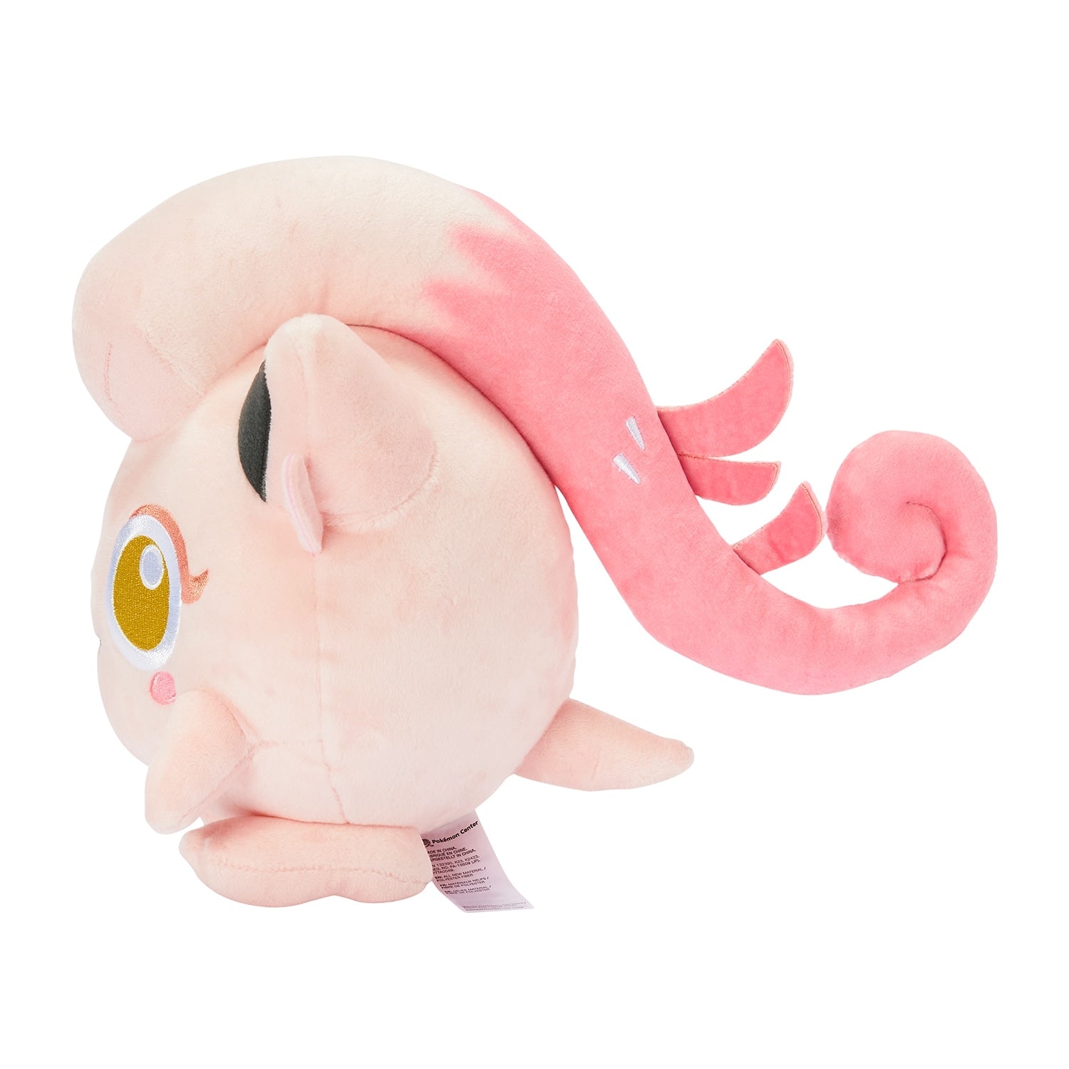 Pokemon salmon tail plush toy standing on a shelf, shipped from Japan