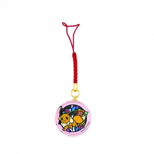 Close-up of Eevee's face on the glass netsuke, Japanese collectible
