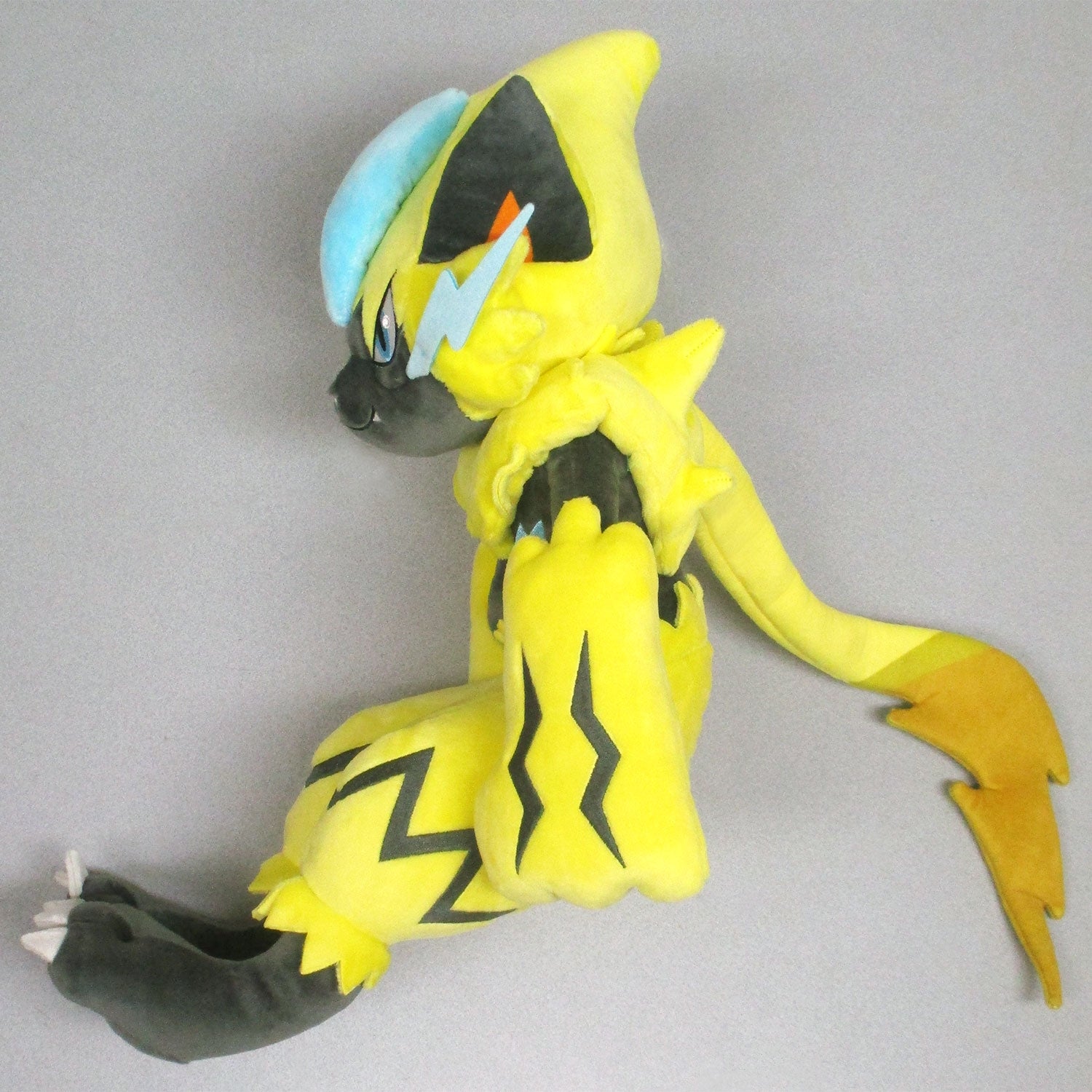Pokemon Zeraora plushie, adorable Japanese collectible with intricate design and stitching