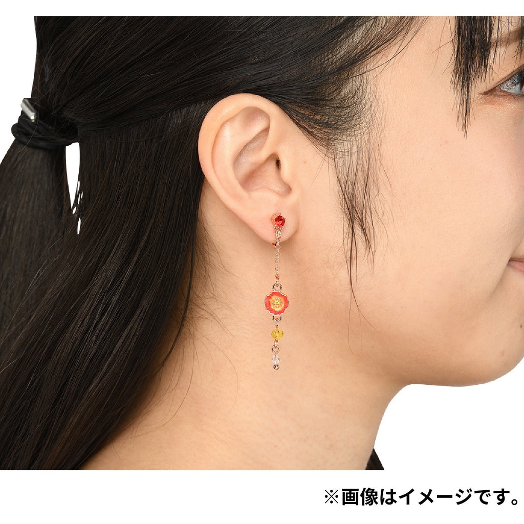 Close-up of Pokemon poppy earrings with Japan origin