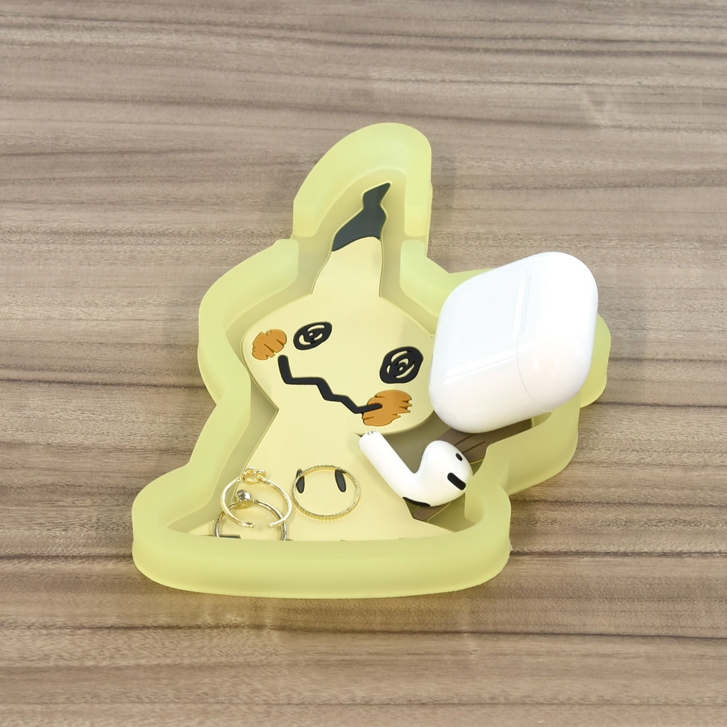 Collectible Mimikyu phone tray, made in Japan, with vibrant colors and sturdy build
