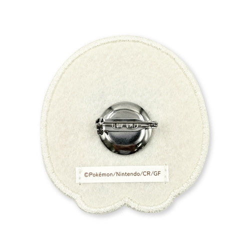 Close-up of Rowlet Pokemon pin with detailed wings from Japan