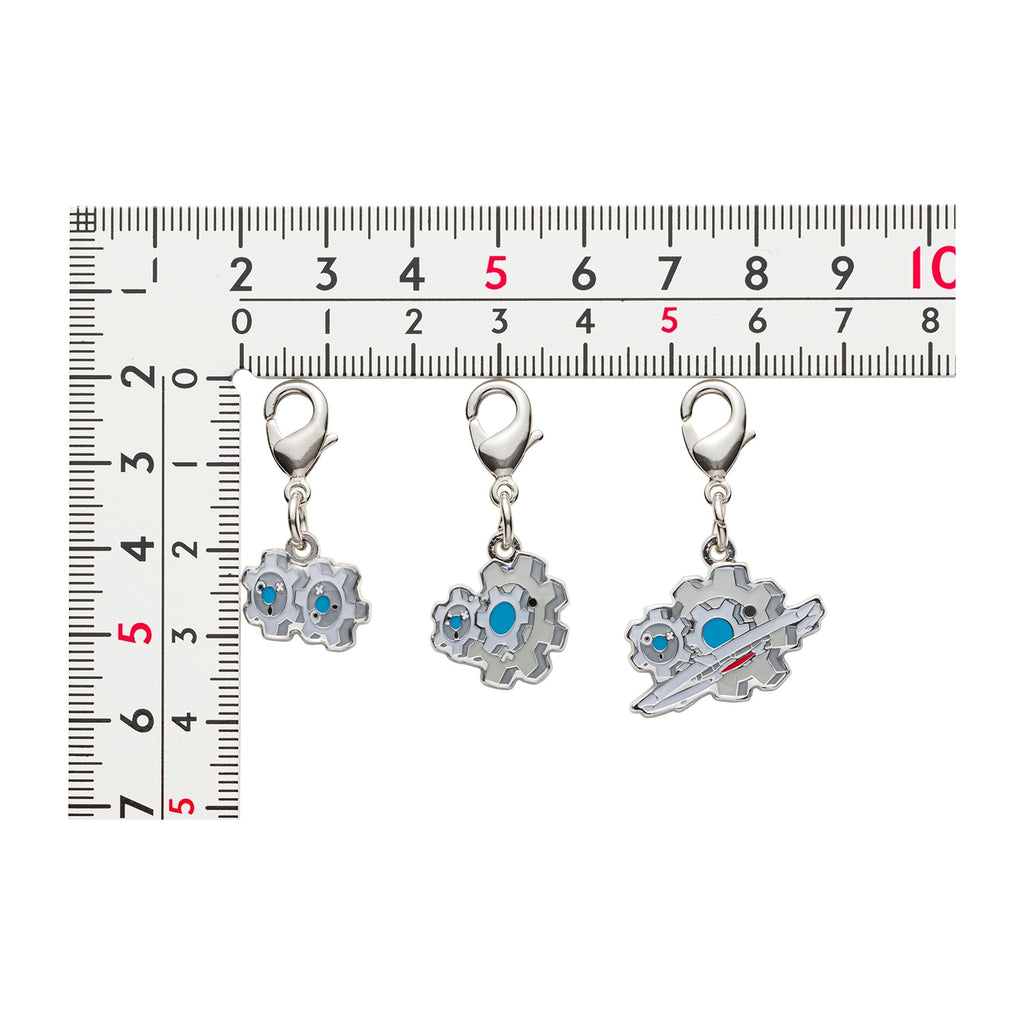 Close-up of Pokemon metal charm with official logo, sourced from Japan