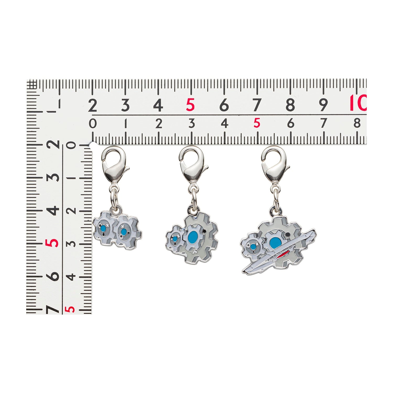Close-up of Pokemon metal charm with official logo, sourced from Japan