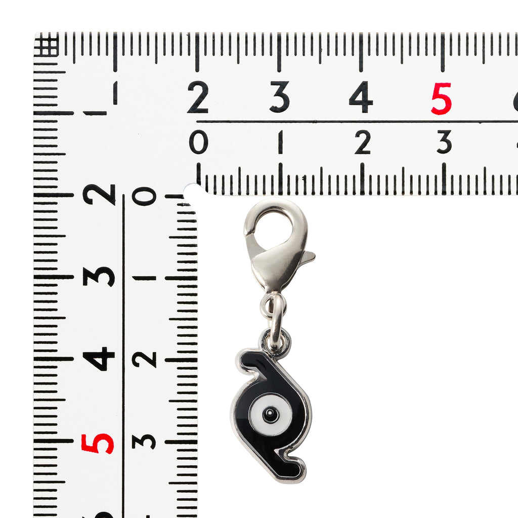 Close-up of Pokemon Metal Charm 201-Z, official Japan merchandise, collectible item