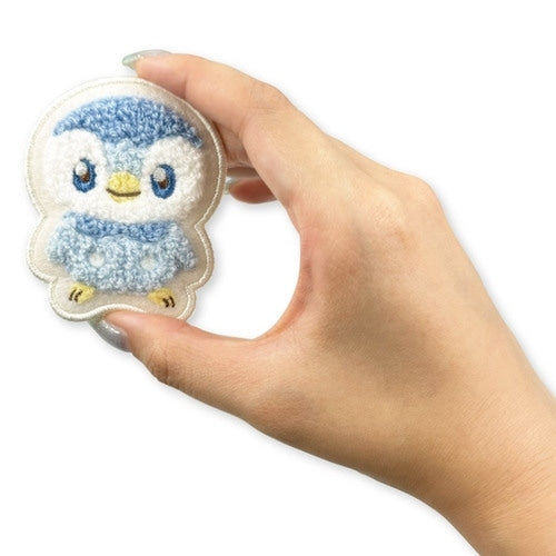 Piplup pin on a white background showcasing its authentic Japanese packaging