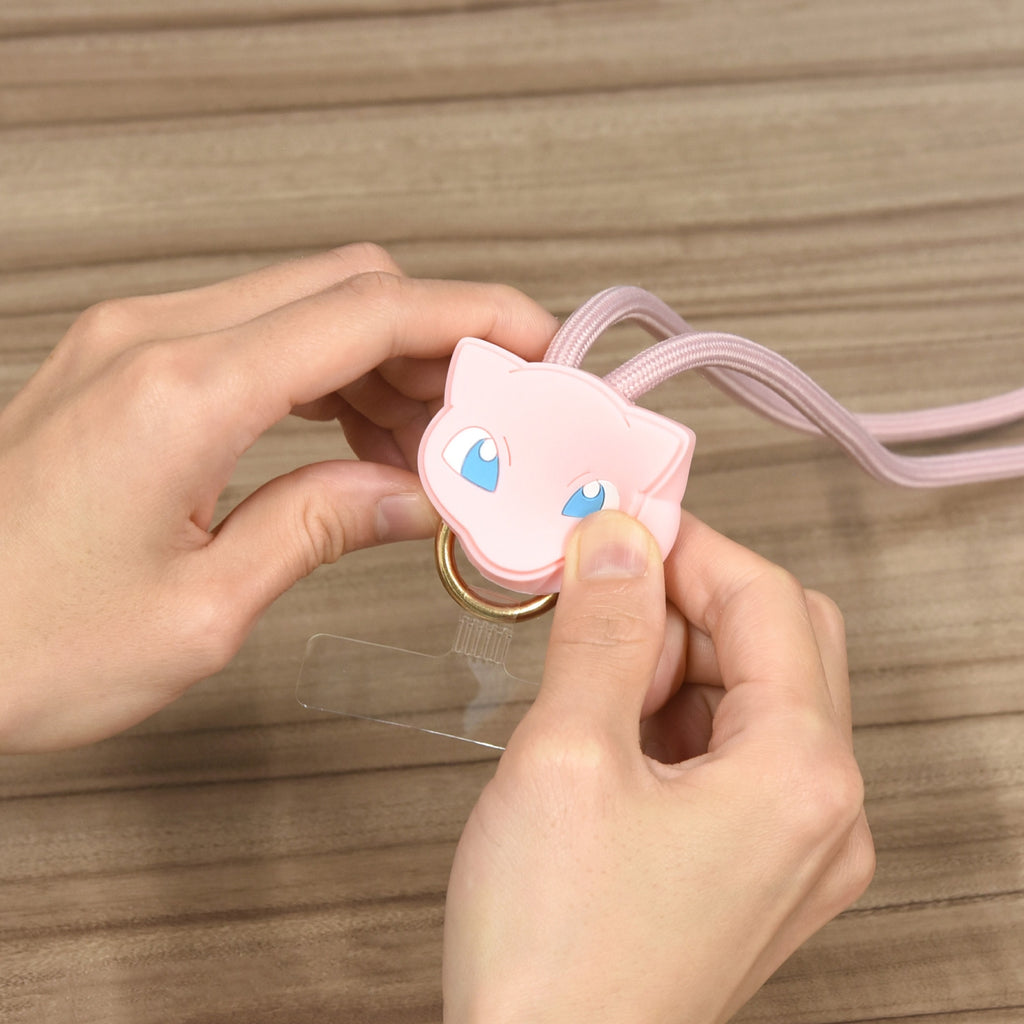 Mew Multi Ring Plus Mascot Strap from Japan, displayed on a phone case with a fun and colorful background