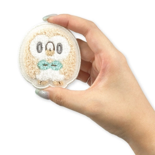 Rowlet pin on a jacket, showcasing anime-style design from Japan