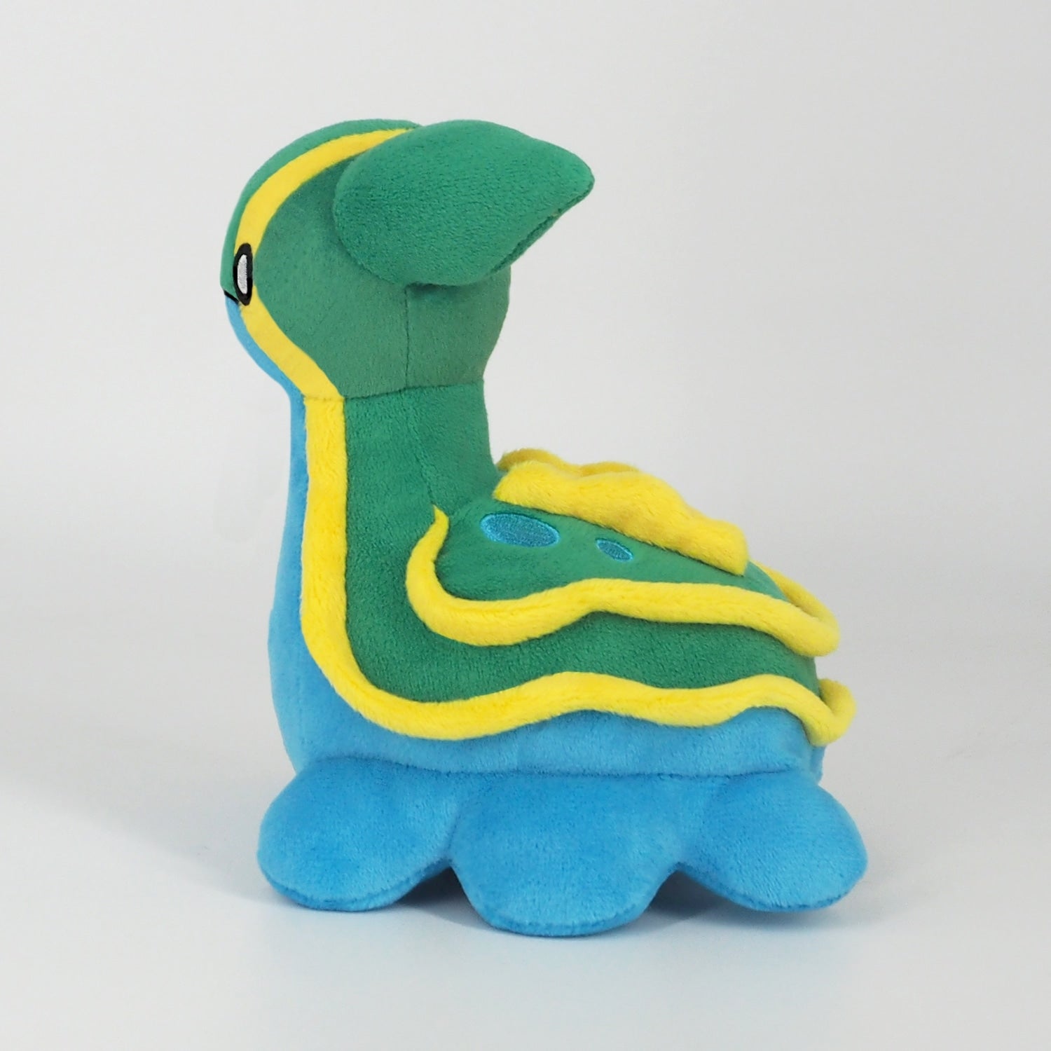 Toritodon plush from Japan with vibrant orange and yellow feathers