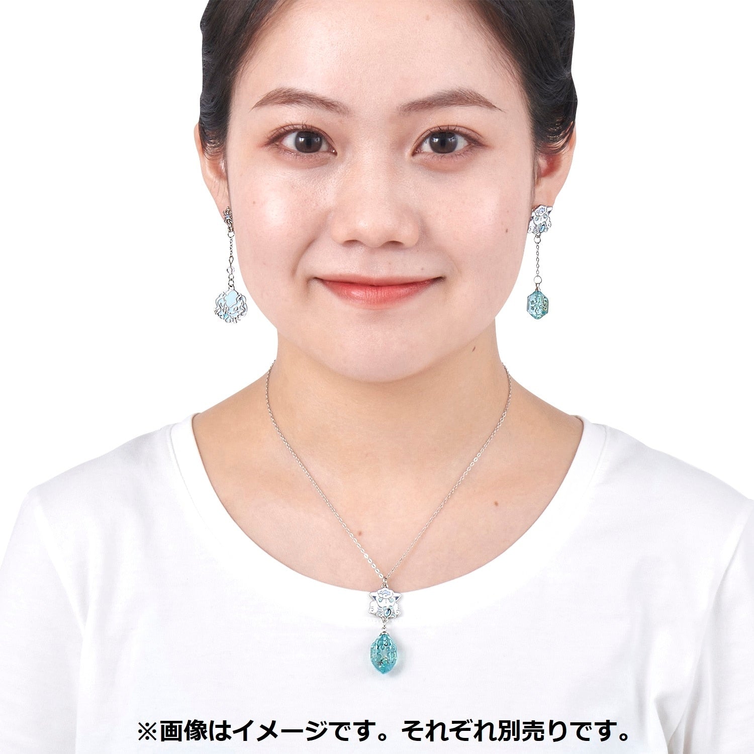 Detailed view of Alolan Vulpix earrings with Japanese collectible authenticity from Japan