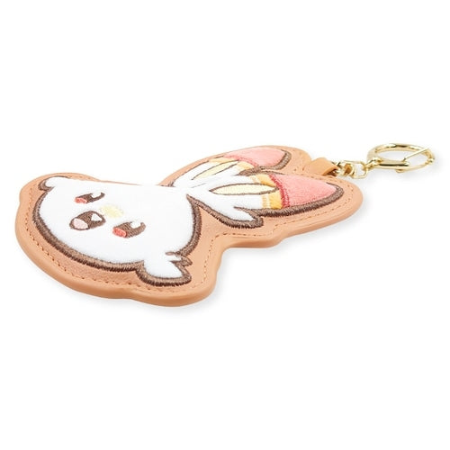 Fluffy Hibani Pokepiece keychain with Pokemon logo, sourced from Japan