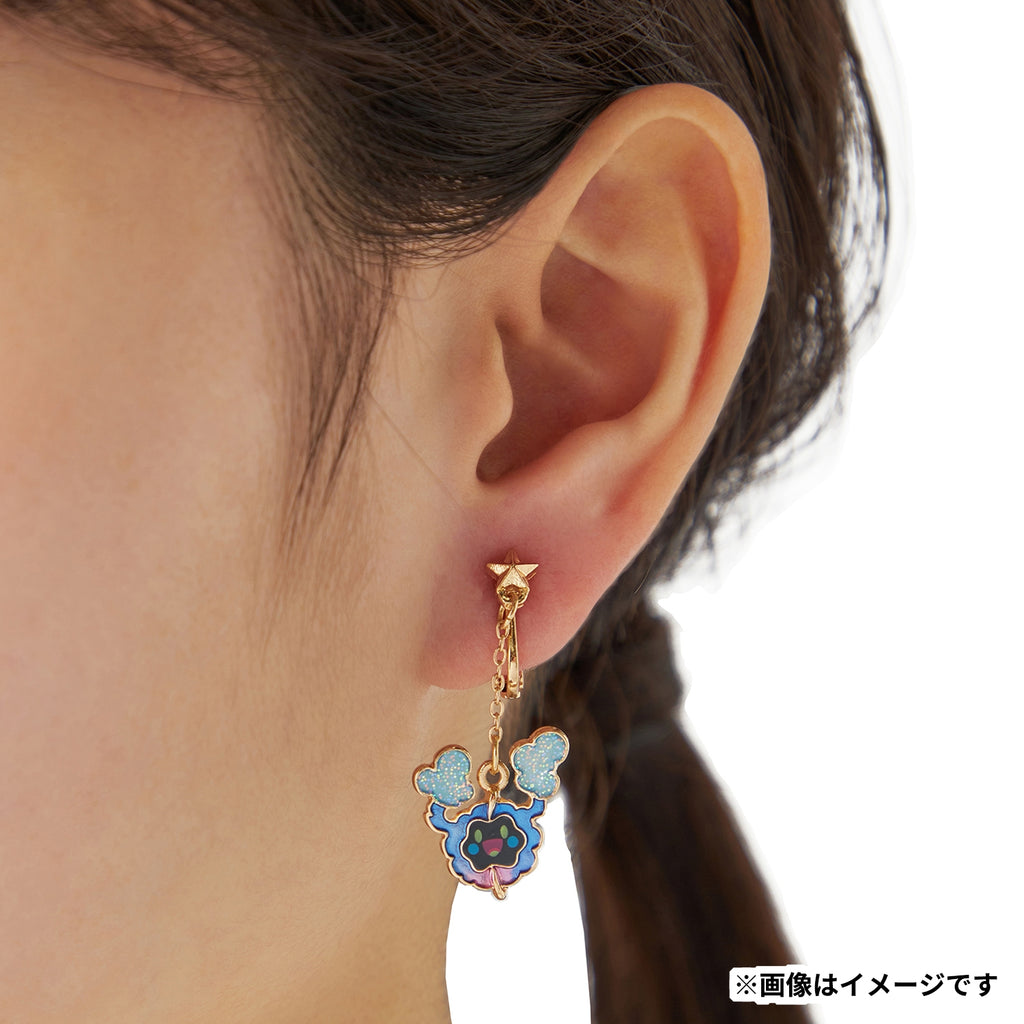 Pokémon Cosmog earrings on display with anime background from Japan