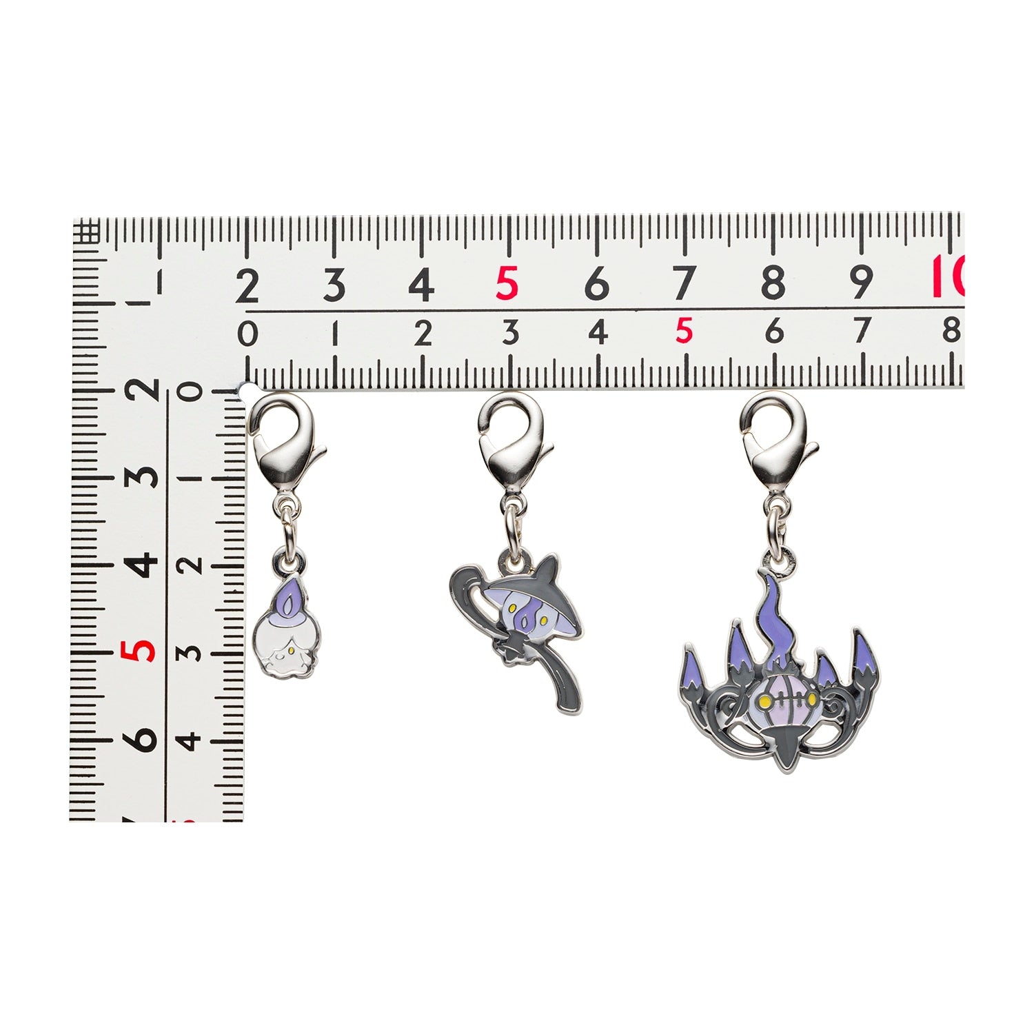 Pokemon Metal Charm 608 and 609 from Japan, showcasing detailed metalwork
