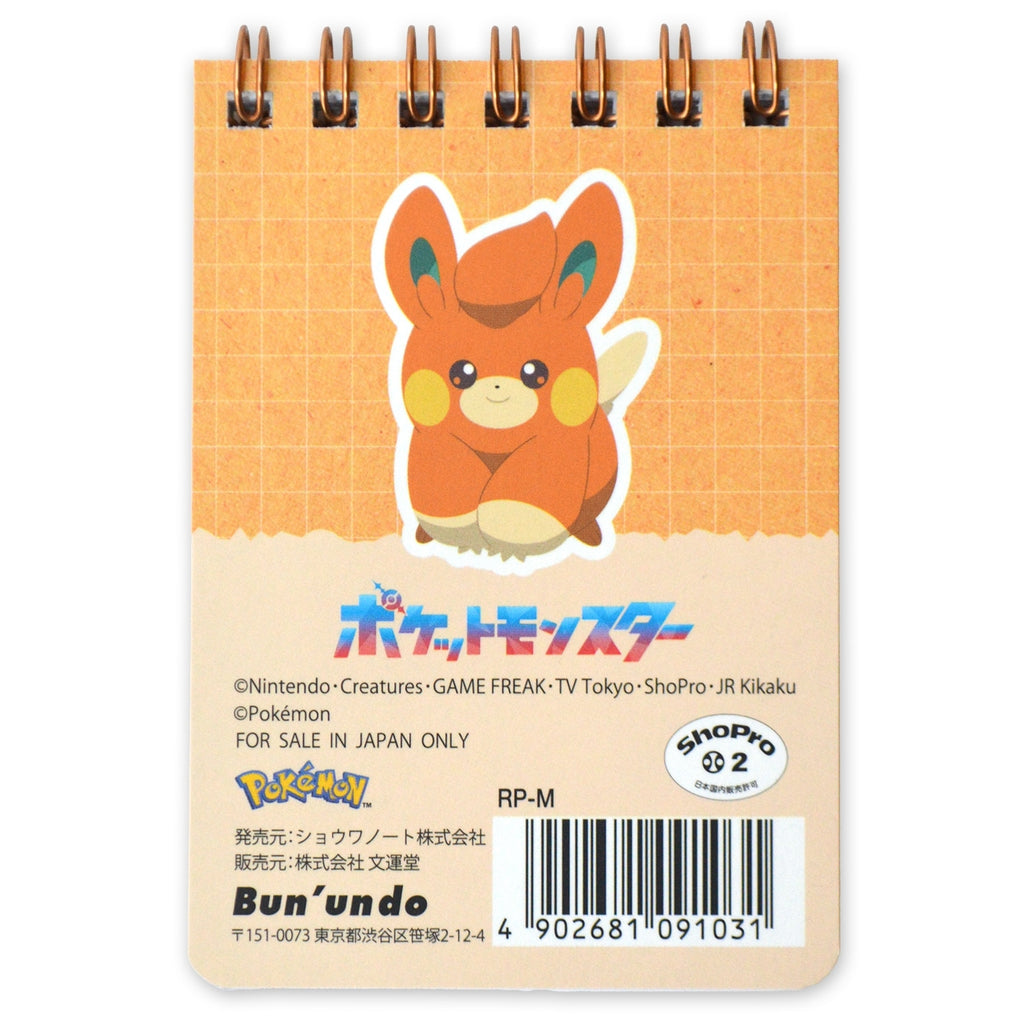 Close-up of Pawmi on the A7 mini ring memo pad, showcasing vibrant colors and details from Japan